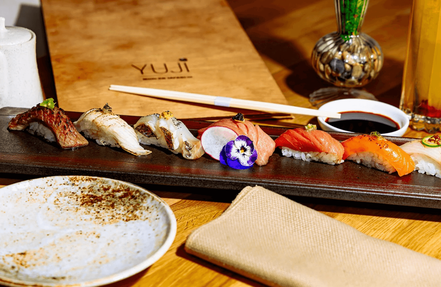 Sushi service at Yuji